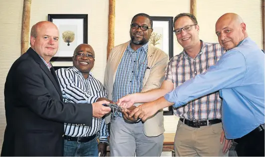  ?? Picture: ROB KNOWLES ?? NEW HANDS: The keys to the Fish River Sun were handed over to the Department of Rural Developmen­t and Land Reform (DRDLR) on Friday who, in turn, handed them over to The Mantis Collection. From left, are Sun Boardwalk general manager Mike van Vuuren,...