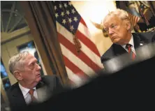  ?? Brendan Smialowski / AFP / Getty Images ?? Defense Secretary Jim Mattis (left ) will leave by March 1. The president said he would name his successor soon.