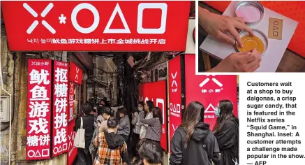  ?? — AFP ?? Customers wait at a shop to buy dalgonas, a crisp sugar candy, that is featured in the Netflix series
“Squid Game,” in Shanghai. Inset: A customer attempts a challenge made popular in the show.