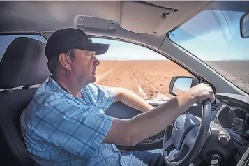  ?? ROBERTO E. ROSALES/JOURNAL ?? Mexican farmer Pedro Suderman drives his diesel truck to monitor the progress on a drip irrigation system he has installed in his chile, onion and watermelon fields in the northern Mexico Mennonite community of El Camello.