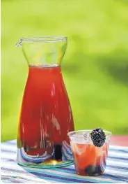 ?? DEB LINDSEY/FOR THE WASHINGTON POST ?? Bramble On Punch uses summer blackberri­es for both flavor and show. You can use a good silver tequila for this drink, but a mezcal works fine.