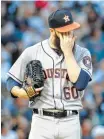  ?? Charles Rex Arbogast / AP ?? Dallas Keuchel collects himself during Tuesday night’s loss to the White Sox. He was pulled after four innings and 92 pitches.