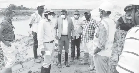  ??  ?? Minister within the Ministry of Public Works, Deodat Indar (centre) with his team during the tour on Friday.