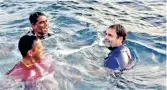  ??  ?? Rahul Gandhi swimming in Arabian sea after he joined fishermen in fishing assignment off Kollam coast