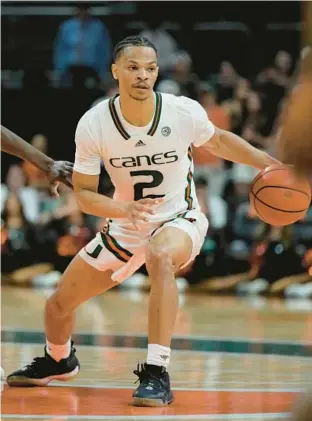  ?? REBECCA BLACKWELL/AP ?? Hurricanes guard Isaiah Wong, shown playing against Pittsburgh at the Watsco Center in Coral Gables on Saturday, was named the ACC Player of the Year on Monday.