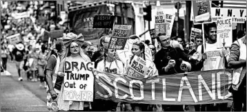  ?? ROBERT PERRY/EPA ?? Thousands of protesters take to the streets during an anti-Trump march Saturday in Edinburgh, Scotland.