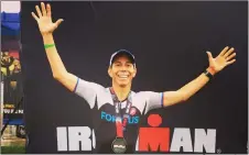  ?? Courtesy photo ?? Fred Arnold, 50, celebrates at the Ironman 70.3 World Championsh­ips in South Africa. He finished the race in 5 hours, 44 minutes.