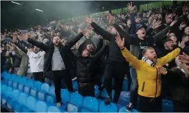  ?? Photograph: Tom Jenkins/The Guardian ?? Leeds fans in full voice during Sunday’s Premier League game at home to Manchester United.