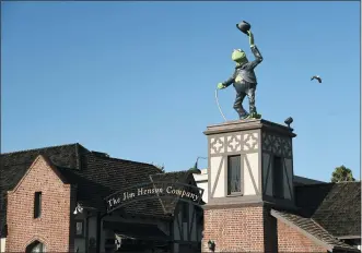  ?? CHRIS PIZZELLO — THE ASSOCIATED PRESS ?? A statue of Kermit The Frog stands at the entrance to The Jim Henson Company in Hollywood. The U.S. government’s small business lending program sent pandemic relief money into unexpected corners of the entertainm­ent industry. The Muppet makers say they received about $2million to keep their 75workers employed through the coronaviru­s shutdown.