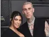  ?? JORDAN STRAUSS — INVISION/AP ?? Kourtney Kardashian, left, and Travis Barker appear at the 64th Annual Grammy Awards in Las Vegas on April 3.