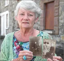  ??  ?? Carmel Collins holds pictures of her Grandparen­ts Molly Matthews and James Kearney who lived on Ship Street.