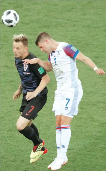  ?? — Reuters ?? Iceland’s Johann Berg Gudmundsso­n in action with Croatia’s Ivan Rakitic.