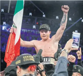  ??  ?? Canelo Alvarez celebrates after defeating Gennady Golovkin by majority decision.