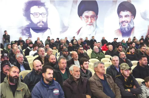  ?? (Mohamed Azakir/Reuters) ?? LEBANON’S HEZBOLLAH supporters listen to leader Hassan Nasrallah’s televised address at a memorial ceremony to mark one week since the passing of former Hezbollah deputy Muhammad Yaghi, in Baalbek, earlier this year.