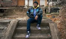  ??  ?? Homewood youth sports coach Ayo Young says his neighborho­od is stigmatize­d by the rows of abandoned and unsafe homes dotting its streets.