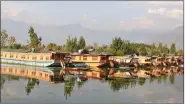  ?? IANS ?? Houseboats and ‘shikaras’ anchored on the banks of Dal Lake, in Srinagar.