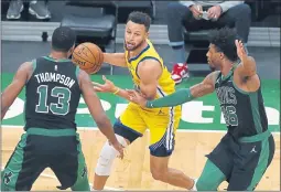  ?? MICHAEL DWYER — THE ASSOCIATED PRESS ?? Boston Celtics’ Tristan Thompson (13) and Marcus Smart (36) defend against Golden State Warriors’ Stephen Curry during the second half on Saturday in Boston.