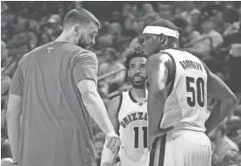  ??  ?? Grizzlies center Marc Gasol, guard Mike Conley, and forward Zach Randolph talk during the game against the Clippers at FedExForum on Thursday night.