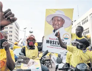  ?? AFP ?? Supporters of the National Resistance Movement celebrate the victory of President Yoweri Museveni after the results of the presidenti­al election in Kampala on Saturday.