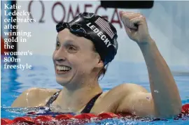  ??  ?? Katie Ledecky celebrates after winning gold in the women's 800m freestyle