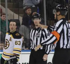  ?? GETTY IMAGES ?? BOX-BOUND: Brad Marchand heads for the penalty box after a second-period cross-checking call in Sunday’s win over the Rangers in New York.