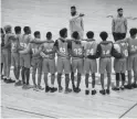  ?? NICK OZA/THE REPUBLIC ?? Coach Erik Hood, on left, and Jeremy Soria of South Mountain talk with the basketball team at their school gym.