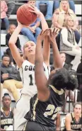  ?? Jeremy Stewart / RN-T ?? Coosa’s Taylor Roberts (left) takes a shot over Rockmart’s Anbria Daniels during Tuesday’s game.