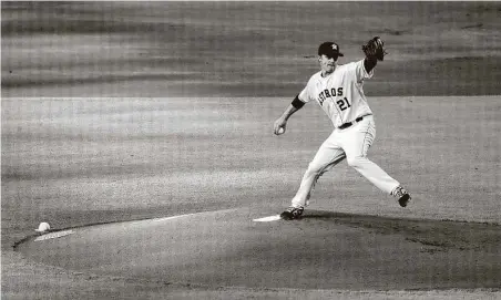  ?? Photos by Karen Warren / Staff photograph­er ?? Zack Greinke picked up his first victory of the season, striking out seven across 61⁄3 innings and scattering seven hits.