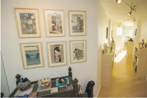  ??  ?? A mirrored wall, left (partially out of view), visually doubles the foyer and increases daylight in that formerly dark area. Japanese woodblock prints hang over an antique chest from Swat district in Pakistan.