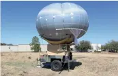  ??  ?? A camera- toting balloon during testing.