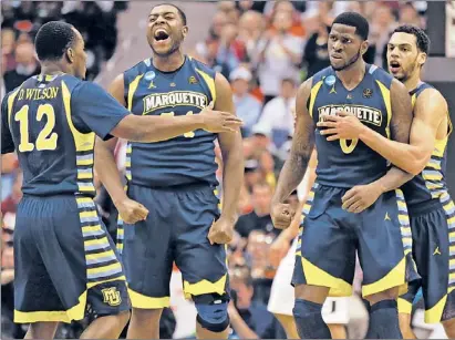  ?? | WIN MCNAMEE~GETTY IMAGES ?? Marquette players celebrate during their East Regional semifinal victory against Miami.