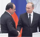  ?? YURI KADOBNOV, AFP/GETTY IMAGES ?? French President François Hollande, left, and Russian President Vladimir Putin wrap up a news conference Thursday at the Kremlin.