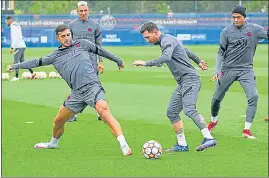  ?? ?? Kylian Mbappe (right) and Lionel Messi (centre) during a training session at Paris Saint-Germain’s training ground in Saint Germain-en-Laye, Paris, on Monday.