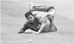  ??  ?? Bangladesh’s Abul Hasan dives as he attempts to field a ball hit by Sri Lanka Board President’s XI batsman Dilshan Munaweera during the one day warm-up match at The Colombo Cricket Club Stadium in Colombo. — AFP photo