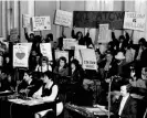  ?? ?? Demonstrat­ors hold up their signs in support of the Holy Redeemer Catholic school in Chinatown during city council hearings in Philadelph­ia’s city hall. Photograph: Courtesy of the Special Collection­s Research Center, Temple University Libraries