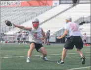  ?? TIM PHILLIS — FOR THE NEWS-HERALD ?? Mentor quarterbac­k Ian Kipp works on a drill during practice Aug. 1.