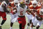  ?? MICHAEL THOMAS — THE ASSOCIATED PRESS ?? Maryland running back Ty Johnson (6) carries it against Texas during the second half of Saturday’s college football game in Austin, Texas. Maryland won 51-41.