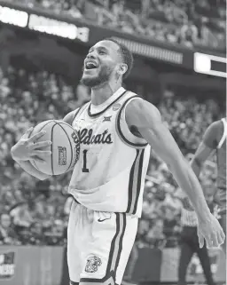  ?? CHRIS CARLSON/AP ?? Kansas State guard Markquis Nowell celebrates after the Wildcats’ second-round win against Kentucky in the NCAA Tournament on Sunday in Greensboro, N.C.