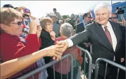  ?? By Paul J. Richards, Afp/getty Images ?? Tough week before crucial primary: Former House speaker Newt Gingrich greets supporters during a campaign rally Sunday in The Villages, Fla.