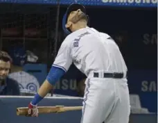  ?? FRED THORNHILL/THE CANADIAN PRESS ?? Blue Jay Jose Bautista, in the DH spot in his return from the DL, loosens up before his first at-bat in Thursday night’s game against the Angels.