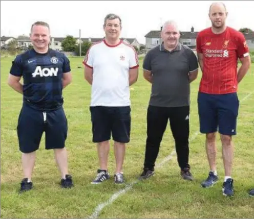  ??  ?? Grove Rangers chairman and founder member Brendan Gregory (second right) with some of the club’s managers and trainers, (l to r) Andy Leonard,