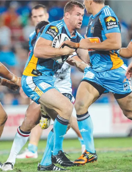  ?? Picture: ADAM HEAD ?? Brenton Lawrence in action for the Titans against the Sydney Roosters in 2010.