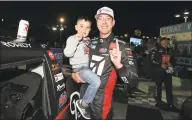  ?? Matt Sullivan / Getty Images ?? Kyle Busch won Friday night at Las Vegas to extend his streak of Truck Series victories to seven consecutiv­e dating to 2018.