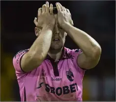  ??  ?? A shattered Craig McCabe after the final whistle.