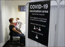  ?? MARCIO JOSE SANCHEZ — THE ASSOCIATED PRESS FILE ?? A patient receives a shot of the Moderna COVID-19vaccine at a CVS Pharmacy branch in Los Angeles.