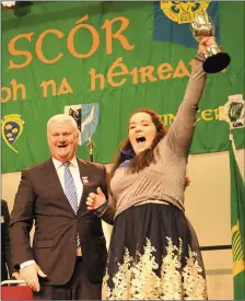  ??  ?? Maggie Moynihan, Cullen received her All Ireland Scór na nÓg Cup from GAA President Aogán O’Fearghaill earlier this year. Maggie Moynihan collected outright honours in solo singing after delivering a superb rendition of “Cooraclare” to land an...