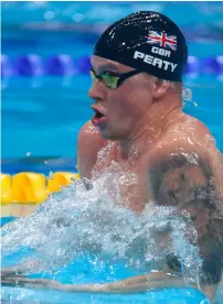  ?? AP ?? Britain’s Adam Peaty sets a new world record in a men’s 50-metre breaststro­ke heat during the swimming competitio­ns. —