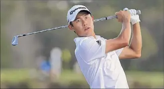  ?? Mike Ehrmann / Getty Images ?? Collin Morikawa plays a shot on the 13th hole, which he began with a five-stroke lead. But he wound up with a bogey and added another on 17 to cut his lead to two shots.