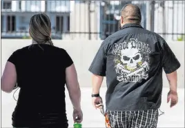  ?? Patrick Connolly ?? Las Vegas Review-journal @Pconnpie Supporters of arrested Vagos Outlaw Motorcycle Gang members walk out of the Lloyd George U.S. Courthouse on Friday.