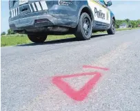  ?? PAUL CHIASSON, THE CANADIAN PRESS ?? A police car drives along le Rang Sainte-Anne in Notre-Dame-de-Stanbridge, Que., where three children aged five and under died after a tractor accident Wednesday night.